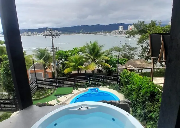 Casamar paraíso na praia com a vista do mar dos sonhos piscina e spa Guarujá